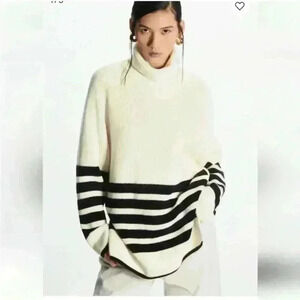 COS Roll neck sweater in white and black striped wool and cotton blend